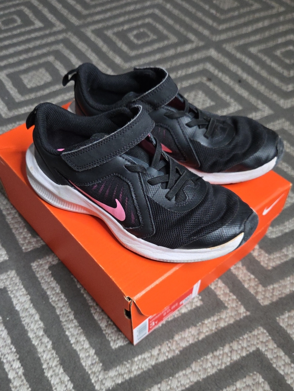 Nike Kids Black Sneakers with Pink Swoosh